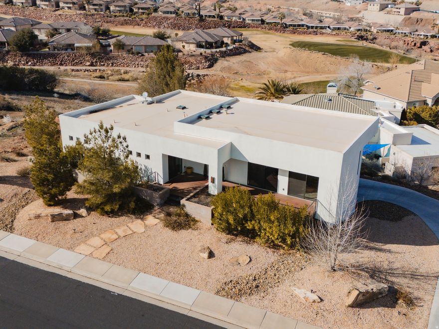 Contemporary, one-of-a-kind home in Southgate Hills with expansive views of the surrounding mountains, city, and golf course, located directly across from the 18th fairway. Thoughtfully designed with exceptional attention to detail, featuring multiple decks that create private outdoor living spaces. The professional chef's kitchen includes a walk-in pantry, soft water system, water filtration, and tankless hot water. The third bedroom offers a private exterior entrance, ideal for guests or flexible living. Abundant storage is available beneath the home. Buyer to verify all information.