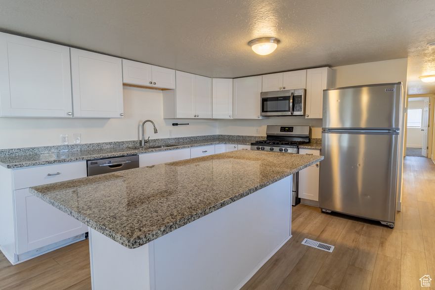 Step inside this updated single-wide mobile home offering a surprisingly spacious feel! The large family room is perfect for relaxing or entertaining, while the kitchen features a convenient island that adds both style and functionality. With 3 bedrooms, a full bathroom, plus a private half bath in the primary bedroom, this home provides comfortable living for all. All appliances are included, making your move-in a breeze. Located in a welcoming community that offers great amenities, including a sparkling pool to enjoy on warm days, this home is a fantastic opportunity at an affordable price.  CALL PARK MANAGEMENT FOR RULES AND LOT RENT! Square Footage provided as a courtesy - buyer to confirm square footage. We can help guide financing! Please note this home has lot rent and rules. Please contact the community management and NOT the listing agent or owner directly for this information. Home can not be moved.