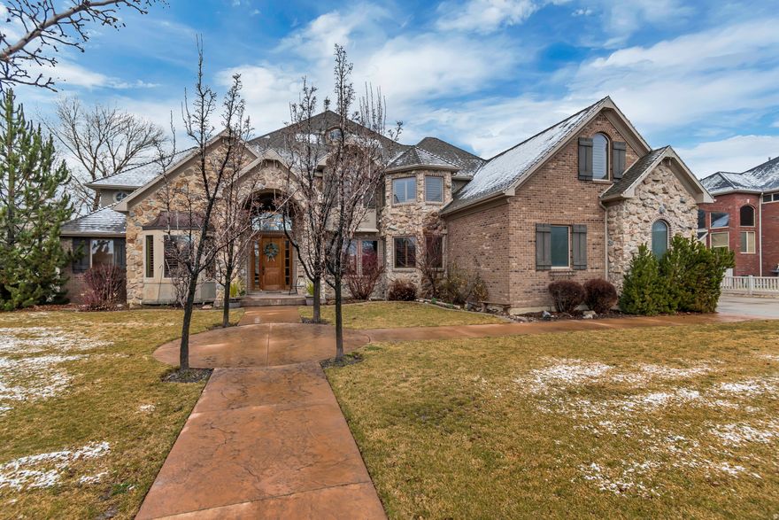 Meticulously maintained and beautifully designed, this spacious South Weber home offers an exceptional floor plan perfect for both everyday living and entertaining. The backyard is a true retreat, featuring a large swimming pool with slide and a covered patio ideal for relaxing or hosting guests.  The home includes five bedrooms, highlighted by a luxurious primary suite with a spa-inspired bathroom, freestanding soaking tub, and a cozy two-way fireplace. A dedicated office provides a quiet workspace, along with an additional study nook for flexible use.  Upstairs, a large game and entertainment area with a wet bar creates the perfect setting for movie nights and gatherings. A detached garage offers plenty of space for extra vehicles, recreational toys, or storage and a guest house above the detached garage.