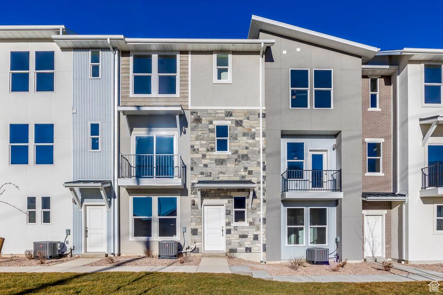 This is a Three-Bedroom Townhome at the Ridge at Spanish Fork. Buy now and use our preferred lend and get a $10,000 credit to buy down your interest rate or for closing costs! This is the Soho floor plan that boasts the largest primary suite in our development. The lower level consists of a family room and an exceptionally deep two-car garage for added convenience. The second level embraces an open concept, featuring the kitchen, dining area, family room, a sizable laundry room, a half bath, and a versatile bedroom that can double as an office. The top floor has the large primary suite and an additional bedroom and full bath. It's a great property. The Ridge at Spanish Fork is a beautiful townhome community located on the east end of Spanish Fork with panoramic views of the mountains and valley. The Ridge has a clubhouse with a fitness center and an indoor/outdoor pool, along with new pickleball courts and a dog park. The development is conveniently located near shopping (there is a grocery store across the street and Costco is just down the road), restaurants, schools, and only minutes from I-15 and the mouth of Spanish Fork Canyon. The Ridge offers two, three, and four-bedroom floor plans. There is new inventory available and we also work with investors. Come and tour the model home and choose your new townhome today!