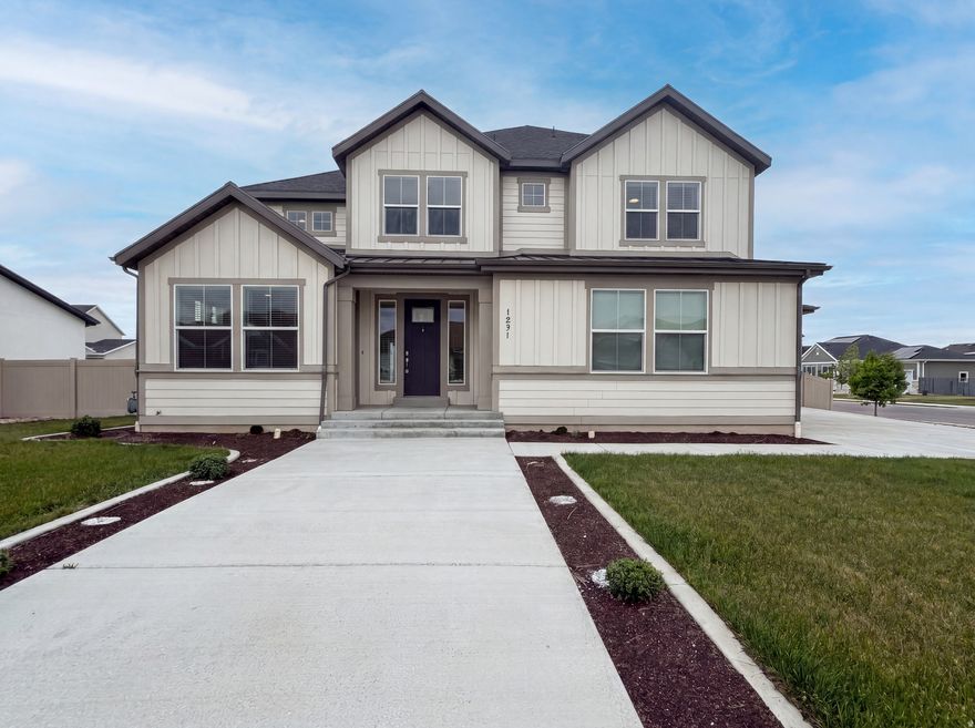 Check out 1251 N 2525 W, a residence with a functional layout providing practical comfort. It features a fireplace, and the kitchen includes an island with all stainless steel appliances and an accent backsplash. The primary bedroom contains a walk in closet, while its bathroom is equipped with double sinks, a separate tub, and a shower. An exterior deck extends to a fenced in backyard. Experience comfort and style in this thoughtfully designed residence. Included 100-Day Home Warranty with buyer activation