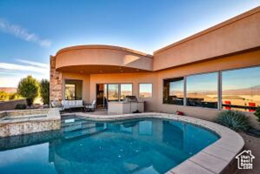 Relax and enjoy the pool and spa with the spectacular views of Pine Valley mountain or the evening lights of St. George and Washington. This Stone Cliff Custom built 4 bed, 4 bath, 3 car garage Tuscany style home is a must see if you are looking for your dream home in St. George. Perfect for the gourmet cook and entertaining family and guests well building memories enjoying the numerous amenities included.