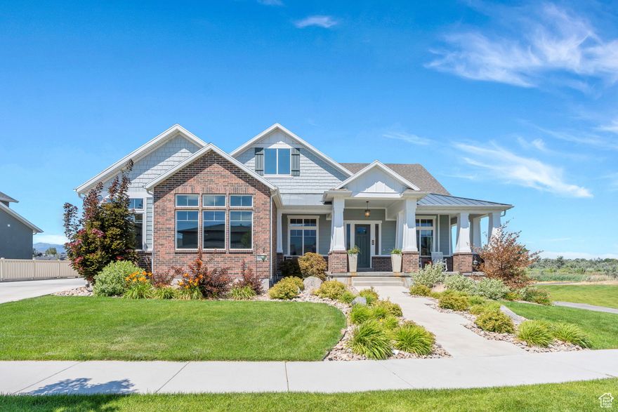 Stunning Former PARADE OF HOMES Property! $100K Price reduction!! Don't miss this opportunity!!  This professionally designed, custom-built home right on the Jordan River Parkway Trail is a rare blend of elegance, comfort, and functionality. Open, light and bright, with 10' ceilings and upgraded engineered hardwood floors, every detail has been thoughtfully curated, and every desired upgrade included. The gourmet kitchen features commercial-grade appliances, quartz AND granite countertops, and custom cabinetry-perfect for the inspired chef. Enjoy seamless indoor-outdoor living with multiple covered decks, a full wrap-around porch, and a walkout basement leading to beautifully landscaped grounds ($30K in upgrades). The backyard opens to protected open space and the Jordan River Parkway Trail, offering direct trail access with no neighbors behind. Inside, you'll love the built-in cabinetry, custom shiplap details, upgraded fixtures throughout, and a show-stopping theater room-screen, projector, and seats included. The luxurious owner's suite includes a spa-like bath with a freestanding tub, custom shower, and smart laundry access from the master closet.   Thoughtful extras include transom windows, an EV charging station, oversized garage with a cool pet wash clean-up and room for toys, huge cold storage, and even an attached storage garage under the third bay.  And fully paid and INCLUDED  Solar Panels provide efficient power to the home. This is upscale living at its finest.  Conveniently located in Draper with direct freeway access.  Close to parks, nearby fishing ponds, and the Jordan River and trails.  Only minutes away from shopping and the canyons for skiing and recreation.  This home is a one-in-a-million opportunity--don't miss your chance to own a masterpiece!