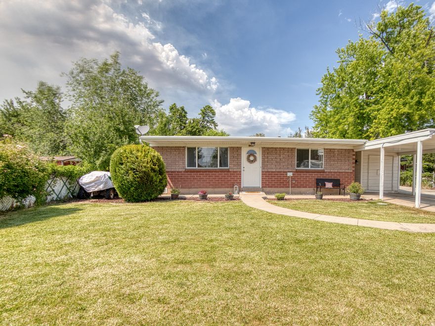 STOP RENTING & START OWNING! Immaculate, move-in ready brick rambler in Layton featuring vaulted ceilings, updated kitchen, central air, RV parking, covered carport, storage shed, and a fully fenced 0.19-acre lot with beautiful landscaping & auto sprinklers. No HOA! Clean, updated, affordable, and full of value-this is the turnkey home buyers have been waiting for!
