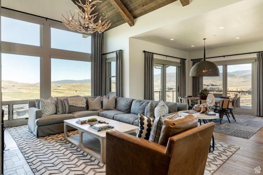 This stunning 4-bedroom, 3.5-bath Cottonwood floor plan at Victory Ranch spans 3,226 sq ft and captures breathtaking views of Deer Valley, the Uinta Mountains, and the Rees Jonesdesigned golf course. Thoughtfully designed by Barclay Butera, the interior showcases Duchateau flooring, rich barnwood accents, a wood-burning fireplace, beautiful furniture, designer wallpaper and custom lighting and draperies in each room. The main level features an open floor plan with great room, vaulted ceilings, gourmet kitchen with Wolf and Sub-Zero appliances, coffee bar, wine fridge, dining room, laundry room, mud room, powder room and a King en-suite with private balcony. On the lower level you will find 3 bedrooms, including a spacious bunk room, 2 bathrooms, and a separate living room.  Venture outside and dine on the newly stained deck or gather around the fire pit while soaking in the scenic views and peaceful evenings at the ranch.  A perfect blend of rustic warmth and modern elegance, schedule your showing today and make this beautiful furnished cabin home yours! Victory Ranch is a private, four-season community amidst 6,250 pristine acres along four miles of the Upper Provo River. Amenities include an 18-hole Rees Jones-designed golf course, world-class fly fishing, upland bird hunting, 30+ miles of mountain biking and hiking trails, 5-stand shooting facility, archery range, 4x4 adventures, snowmobiles, kids zip-line, backcountry yurts, fishing ponds, multiple restaurants, shuttles to Deer Valley & Park City, a ski-in/ski-out lodge in Park City, and more than 3,500 acres of untouched backcountry. The Post Clubhouse includes our concierge team, heated pool, hot tubs, lounge, and coffee/ice cream bar. The Barn features a fitness center, spa, general store, pizza and ice cream parlor, art studio, game room, indoor basketball/sport court, tennis, paddle, and pickle courts, ice rink, swimming pool with food and beverage service, waterslide, and event lawn for endless family fun. Victory Ranch is less than an hour from Salt Lake airport, approximately 15 minutes from Deer Valley and 25 minutes from Park City.
