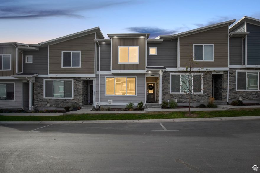 Beautiful and move-in-ready Herriman townhome featuring a bright, open main floor with white cabinetry, quartz countertops, and modern finishes throughout. The upper level includes spacious bedrooms, each with walk-in closets, and wide hallways that enhance the open, airy feel. The fully finished basement offers a large entertaining area-perfect for a media room, home gym, or play space. Smart home features include a Ring doorbell, smart thermostat, and smart garage door opener, adding convenience, efficiency, and security. The attached garage also features epoxy-coated flooring for a clean, durable finish. Ideally located near parks, schools, shopping, and with quick access to Mountain View Corridor, this home combines style, comfort, and functionality in one of Herriman's most desirable communities.  Check out the video tour!