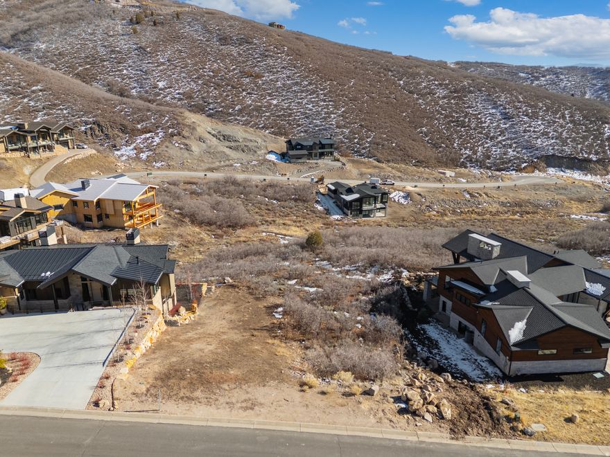 Build your dream home on this lot that's a flat, slight downhill build with views to the east of open space mountains. The perfect spot for entertaining, your home will capture beautiful sunrises over the mountains, stars at night, and evening shade. Located in the heart of the Soaring Hawk community in Hideout near Park City, the lot is in a small subdivision that allows up to 3500 square feet homes. Enjoy this community that's made to maximize your outdoor lifestyle. This lot is just 45 minutes from the SLC international airport and a short 15-minute drive to Park City Main Street. Enjoy the trails, views, clean air, and freedom of being close to Park City and just minutes from the Deer Valley Gondola along with summertime boating at Lake Jordanelle