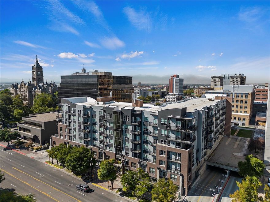 This stylish 2 bedroom 2 bath condo features tall ceilings, a large open kitchen, bar seating, and massive windows that bathe the unit in natural light. Perfect for entertaining, the conversation can flow from the great room out to nearly 300 square feet of private patio space! The primary bath is deluxe with a garden tub, shower, and walk in closet. Just steps from TRAX at Library Square, with quick access to the U of U, restaurants, nightlife, and the airport. The Metro is pet friendly with a fenced in dog run. Rental rights are transferable to the new owner.