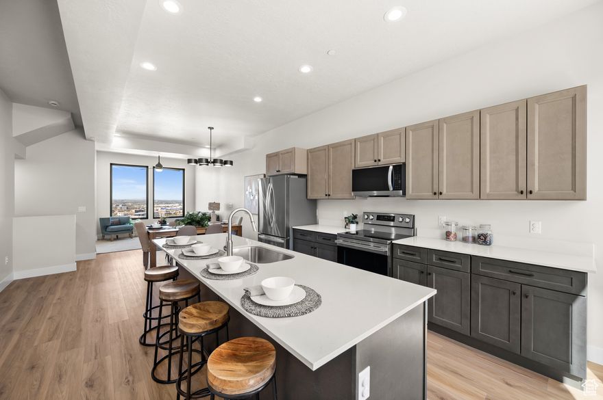 Discover a beautifully crafted 3-bedroom, 3.5-bath townhouse that blends modern comfort with stunning Salt Lake Valley views. This inviting home features premium Anderson 100 Series fiberglass windows that fill every room with natural light, creating a bright and welcoming atmosphere.  The kitchen flows seamlessly into the open living and dining areas, perfect for both everyday living and entertaining. Equipped with a high-end instantaneous water heater, this home offers efficient, on-demand hot water for your comfort and convenience. Parking is a breeze with a 1-car garage and an additional driveway space.  Retreat to the spacious primary suite complete with a private bathroom and ample closet space, alongside two additional bedrooms and full baths that provide versatility for family, guests, or a home office. Ideally located just minutes from outdoor recreation, shopping, dining, and major freeways, this townhouse offers a balanced lifestyle in a sought-after community.  Experience the perfect combination of quality, comfort, and convenience in this charming Salt Lake Valley home.  3D Walkthrough: https://my.matterport.com/show/?m=5iskvEbyiYR