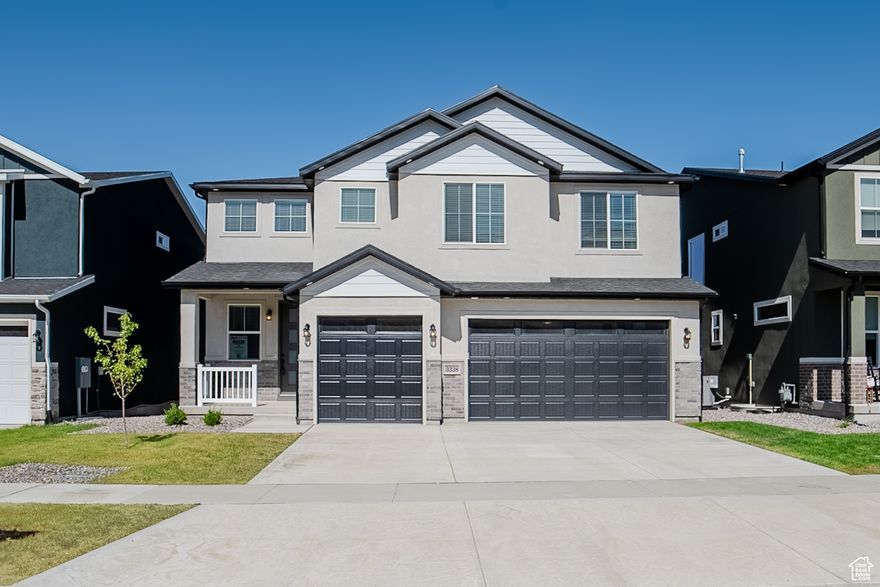 Beautiful finishes: tile backsplash, full tile primary bath, quartz countertops, stainless steel appliances, black railing and black hardware. Park just a block away, beautiful lake views, and walking trail nearby.