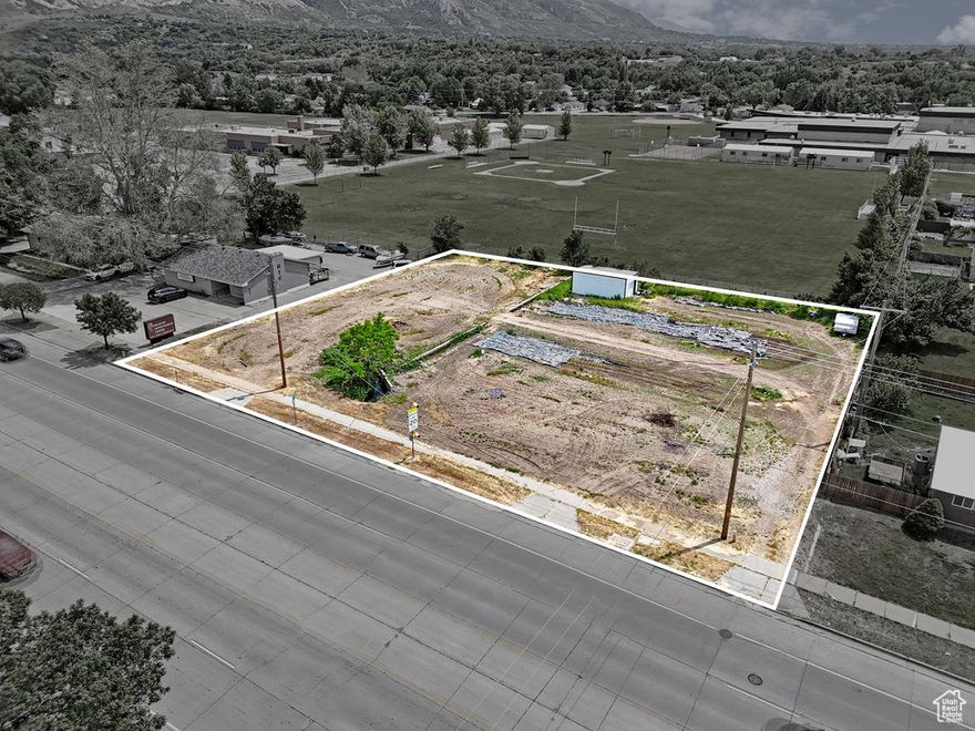 Incredible Opportunity for your business! Highly Visible Frontage on 12th Street. Would be great for Multi-Family Housing, Retail, Commercial, Office Buildings, Automotive, Restaurants, and many other uses. Utilities close by.  This large lot is a blank slate for you to make whatever you like.  Currently zoned residential, formerly there were two single family homes on parcel #'s 13-027-0016 & 13-027-0015.  Both homes have been demo'd and removed.  Due to location and surrounding properties, a zoning change with the city should be easy.  At the back of the lot there is currently a large shed, Mature fruit trees, and a large garden.