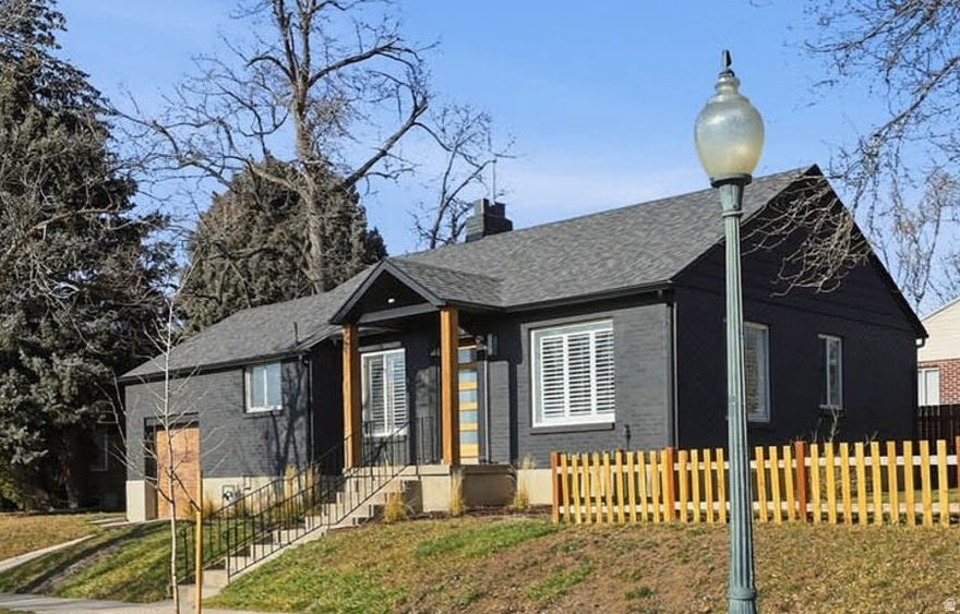 Classic brick bungalow on a fabulous tree-lined street. Beautifully renovated with a spacious open floor plan, gourmet kitchen, and luxury vinyl flooring throughout. Also features attached garage, gas fireplace, nest thermostat, and family room wet bar. New sewer line, new roof and covered gutters, updated electrical. Fully fenced large lot with mountain views. Great central location within walking distance to shopping, dining, & Sugarhouse Park