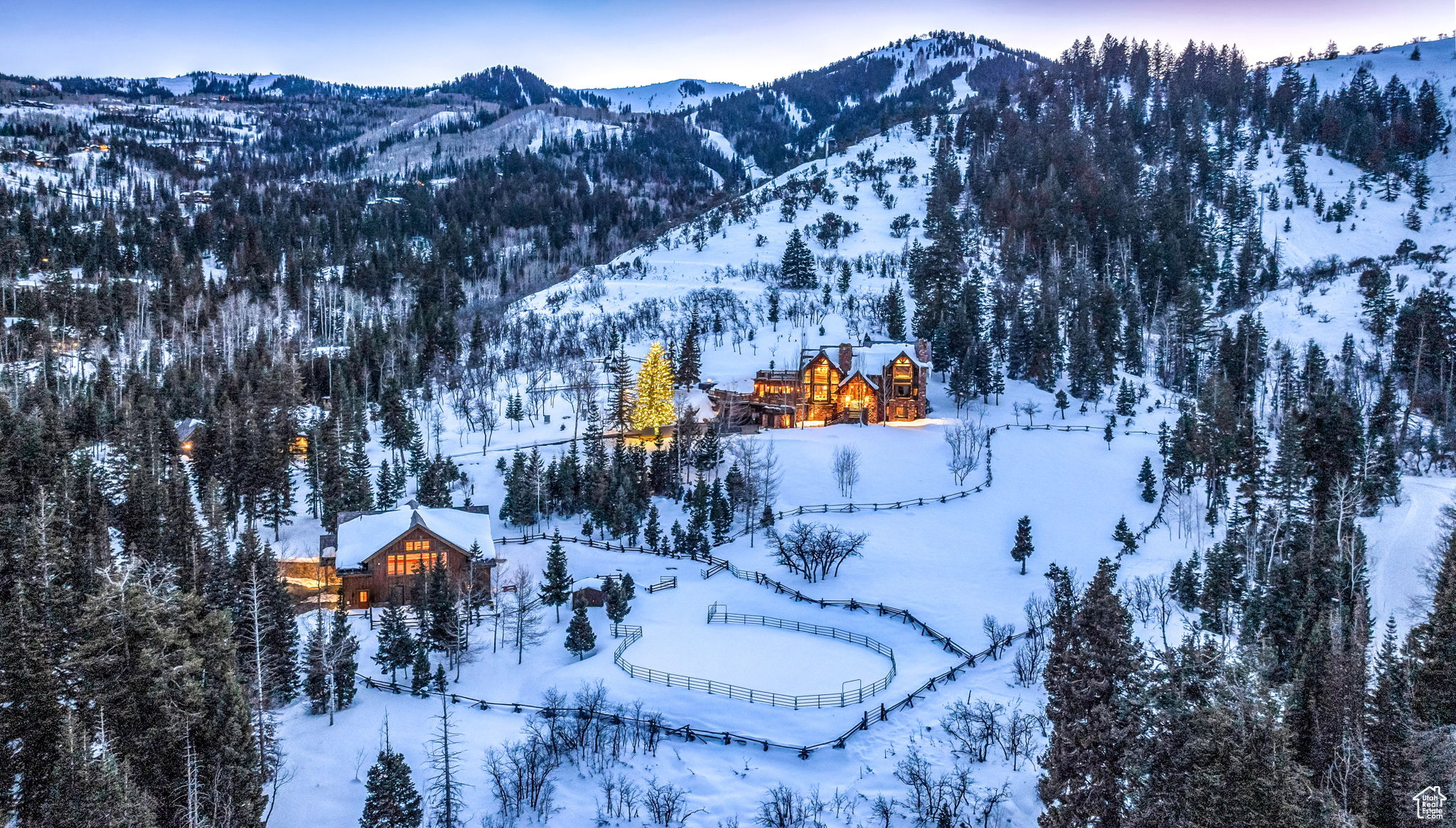 Live your Yellowstone Ranch dream on five acres in the middle of Park City, Utah. Offering an extraordinary blend of seclusion, breathtaking panoramic views, and direct ski access, this remarkable property is a testament to refined living. Designed by Fred Babcock and built by Chamberlain Construction, the property consists of a primary home, guest cabin, and a barn.  The main home spans an impressive 7,700 square feet, featuring timeless beauty and extraordinary craftsmanship that includes five bedrooms, an updated chef's kitchen, lofty ceilings that create an airy ambiance, and expansive patios that embrace the awe-inspiring panoramic ski-resort and down-valley views. The inviting guest cabin offers 1,000 square feet of cozy living space, comprising a comfortable bedroom with a bathroom, fully equipped kitchen, open great room, and attached one-car garage. The expansive barn features 3,166 square feet including two horse stalls, ample storage for cars and equipment, versatile space for hosting grand celebrations, and two additional bedrooms and bathrooms. The barn is connected to a fully fenced-in round pin and separate pasture.  Grab your skis or snowboard and take advantage of private ski access to the base of the Tombstone lift, an irresistible invitation to avoid the crowds and indulge in pristine powder days. During the summer months, explore Park City's world-renowned gold-rated trail system, comprising over 400 miles of scenic biking and hiking paths, all within easy reach of your doorstep.  Less than ten minutes from Park City's history Main Street for exclusive shopping and fine dining. Additionally, both the new Salt Lake City International Airport and the private Heber Valley Airport are just 30 minutes away, so embarking on your next adventure is effortlessly convenient.