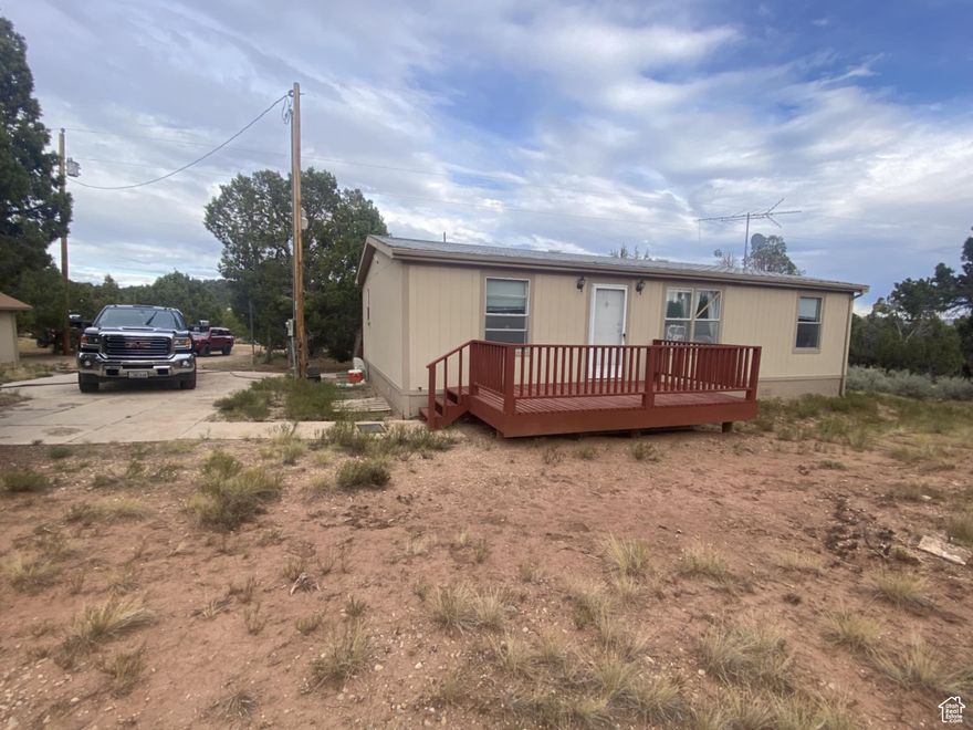 FRUITLAND!  BANDANNA RANCH!  Near the Air Strip!  Hidden in the tall Pinion and Juniper! 3 bedrooms, 2 baths on 5 acres with culinary water, power, and septic system!   A great fire pit and a couple of sheds!   2 decks and a patio!  Resident deer herds!  Miles of back road adventure!  20 minutes from Strawberry, Starvation, Red Creek, and Currant Creek Dams! Very private and quiet! Move in ready!  (Side by Side may also be for sale separately)