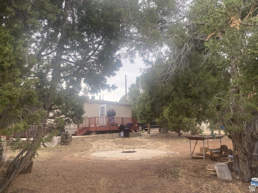 FRUITLAND!  BANDANNA RANCH!  Near the Air Strip!  Hidden in the tall Pinion and Juniper! 3 bedrooms, 2 baths on 5 acres with culinary water, power, and septic system!   A great fire pit and a couple of sheds!   2 decks and a patio!  Resident deer herds!  Miles of back road adventure!  20 minutes from Strawberry, Starvation, Red Creek, and Currant Creek Dams! Very private and quiet! Move in ready!  (Side by Side may also be for sale separately)