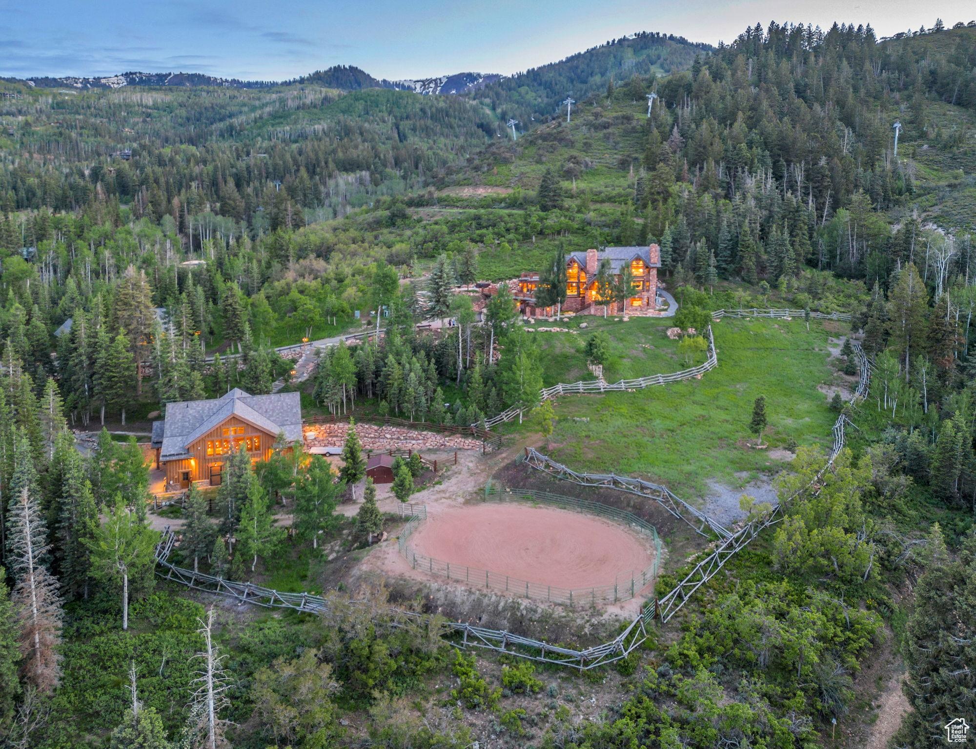 Live your Yellowstone Ranch dream on five acres in the middle of Park City, Utah. Offering an extraordinary blend of seclusion, breathtaking panoramic views, and private ski access, this remarkable property is a testament to refined living. Designed by Fred Babcock, it consists of a primary home, guest cabin, and barn. The main home spans an impressive 7,700 square feet, featuring timeless beauty and extraordinary craftsmanship that includes five bedrooms, an updated chef's kitchen, lofty ceilings that create an airy ambiance, and expansive patios that embrace the awe-inspiring panoramic ski-resort and down-valley views. The inviting guest cabin offers 1,000 square feet of cozy living space, comprising a comfortable bedroom with a bathroom, fully equipped kitchen, open great room, and attached one-car garage. The expansive barn features 3,166 square feet, including two horse stalls, ample storage for cars and toys, versatile space for hosting grand celebrations, and two additional bedrooms and bathrooms. The barn is connected to a fully fenced-in round pin and separate pasture. Grab your skis or snowboard and take advantage of private ski access at the base of the Tombstone lift, an irresistible invitation to avoid the crowds and indulge in pristine powder days. During the summer months, explore Park City's world-renowned gold-rated trail system, comprising over 400 miles of scenic biking and hiking paths, all within easy reach of your doorstep. Less than ten minutes from Park City's history Main Street for exclusive shopping and fine dining. Additionally, both the new Salt Lake City International Airport and the private Heber Valley Airport are just 30 minutes away, so embarking on your next adventure is effortlessly convenient.