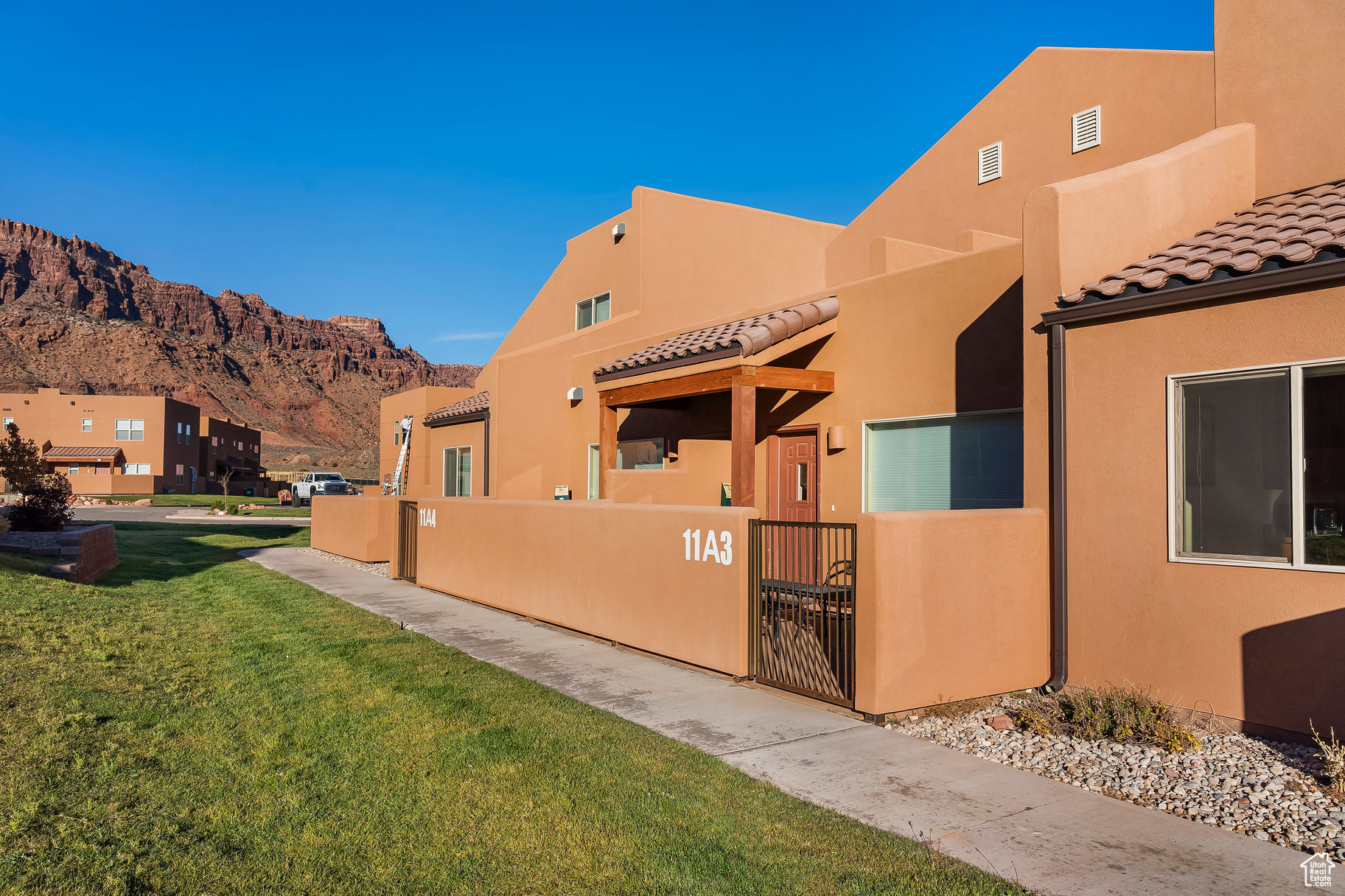 Welcome to Rim Vista! This beautifully maintained 3-bedroom, 2.5-bath nightly rental is being sold turn-key-fully furnished and ready to enjoy or rent. The open-concept layout includes a well-appointed kitchen, spacious living areas, and comfortable bedrooms. Outside, take in the sweeping mountain and red rock views from your private patio. A two-car garage plus ample parking provides plenty of space for guests and outdoor gear. Rim Vista offers excellent amenities including a pool, hot tub, tennis courts, and playground. Just minutes from downtown Moab and world-famous national parks, this property is the perfect blend of investment and adventure.