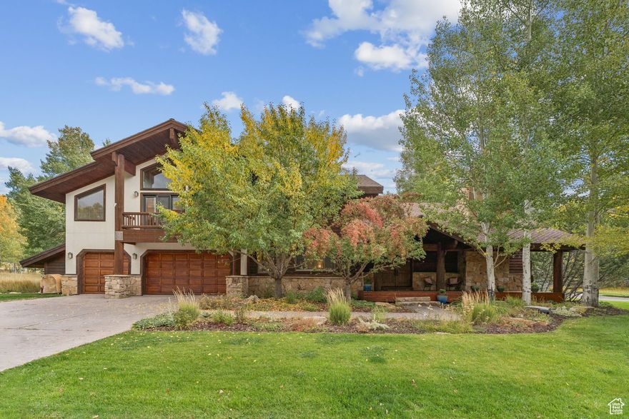 Just minutes from the world-class slopes of Deer Valley and the lively energy of Park City's Main Street, this 5BR/6BA home combines convenience with year-round adventure in close proximity.  Step into the grand Great Room, where 25' vaulted ceilings and oversized picture windows frame stunning views of mountains and tree dotted landscapes. Rich finishes and earthy tones create a classic mountain ambiance, while remodeled kitchen and bathrooms bring a fresh, modern touch. Two bedrooms are located on the main level, while upper level features the large Primary suite with stunning spa-like bathroom and two extra bedrooms with ensuites - one of which is currently utilized as a Family Room. A flexible, heated bonus space with window is located in the third bay of garage, providing a perfect space for studio or gym and could easily be returned to a 3 car garage.  Moments outdoors are enjoyed on the main level lovely front porch and partially covered deck off dining room. Whether as a full-time residence or a cherished second home, this property balances grandeur with comfort.  Take a short stroll to the Solamere Swim and Tennis Club, with amenities tennis, pickleball and swimming pool at your exclusive disposal as a resident of the coveted Solamere community.