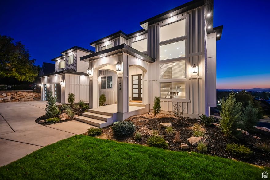 Builder's Own Home  A Masterpiece of Craftsmanship! Built with only the finest materials, expert workmanship, and an undeniable passion for quality, this 8-bedroom, 9-bathroom estate is a true showcase of excellence. As the builder's own home, no detail was overlooked in creating a residence that blends luxury, comfort, and functionality. Step inside to soaring 20-foot ceilings and panoramic windows, flooding the space with natural light and offering breathtaking, world-class views. The heart of the home is a chef's dream kitchen, featuring an oversized island, premium appliances, and a spacious butler's pantry-perfect for entertaining or everyday convenience. Designed for effortless living, this home includes laundry on every level and expansive outdoor deck living spaces, seamlessly blending indoor and outdoor living. The property also features huge garages, providing ample space for vehicles and storage. Additionally, a private ADU (Accessory Dwelling Unit) with its own entry, garage, and private drive offers unmatched flexibility for guests, multi-generational living, or rental income. Every inch of this home reflects superior design and meticulous craftsmanship, ensuring timeless beauty and lasting value. Experience the difference of a home built with heart-this is luxury living at its finest!