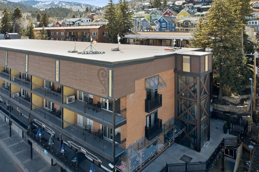 Perfectly positioned in one of the most desirable locations at Treasure Mountain Inn, this corner 1-bedroom, 1-bathroom condominium overlooking Main Street offers a rare blend of privacy, views, and authentic Park City history. This very location once hosted CNN's Sundance celebrity lounge and broadcast coverage during the Winter Olympic Games, placing the residence at the center of some of Park City's most iconic moments.  With windows on multiple sides, the open-concept living space is bright and inviting and enjoys one of the best vantage points of historic Main Street. The living area's Juliet balcony provides a front-row perspective of the energy and charm of Old Town, while the corner orientation adds both privacy and natural light.  Located just steps from the elevator with direct access to Main Street, you are moments from Park City's renowned restaurants, galleries, shopping, and nightlife. The residence also features a separate bedroom for a quiet retreat and a private courtyard patio.  Offered fully furnished, the home is ready for immediate enjoyment as a mountain getaway or income-producing rental. Treasure Mountain Inn amenities include secure underground parking, a year-round hot tub, fitness center, and on-site spa and dining. With Deer Valley and Park City Mountain Resort just minutes away and Salt Lake City International Airport within easy reach, this corner residence offers an exceptional Old Town lifestyle.