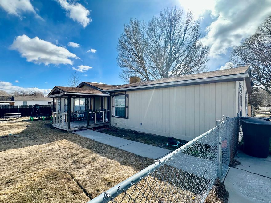 Enjoy peaceful living on a quiet dead-end street in this 4 bedroom, 2 bathroom manufactured home with 1,782 sq ft of open-concept space. Take in stunning sunset views from your fully fenced yard-perfect for pets, play, or relaxing evenings. A wonderful blend of comfort and privacy!   Square footage figures are provided as a courtesy estimate only and were obtained from Carbon County.  Buyer is advised to obtain an independent measurement.