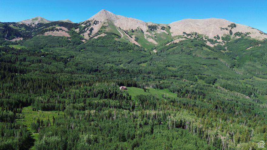 26 acres in the La Sal Mountains of Utah at approximately 10,000 feet elevation. Surrounded by National Forest Service land, this property offers unmatched seclusion and direct access to high-alpine recreation. Blue Lake is only about 200 yards away, providing fishing and trail access within the Manti-La Sal National Forest. A preliminary plat map outlines the potential for subdivision into four parcels. With its elevation, alpine setting, and proximity to public land, this property presents a rare opportunity in the region and has the potential to be a world-class location for a cabin, yurt, or long-term retreat. Properties of this scale and setting are seldom available, making this an extraordinary offering in one of Utah's most scenic mountain areas.