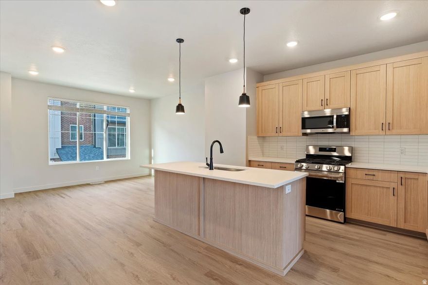 Beautiful 4-bedroom, 2.5-bath townhome with a spacious 2-bay garage. Open-concept kitchen features white oak soft-close cabinetry, quartz countertops, and stainless steel appliances. The owner's suite includes a dual vanity and a sleek euro-glass walk-in shower. Unit is complete and ready for a quick move in. Tour today and ask about builder incentives and first-time buyer down payment assistance. Model open MondaySaturday, 126 PM.