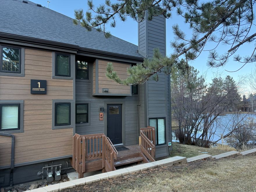 Perfectly positioned on the edge of Canyons Village, and less than 100yds from the mid-station of the new Parking Garage to Plaza Gondola to be completed in 2026, this fully remodeled 2-bedroom plus loft, 3-bathroom residence in the Hidden Creek development, is the perfect blend of contemporary mountain style with effortless ski access. Every detail has been thoughtfully reimagined, offering a fresh, modern aesthetic just steps from Park City's world-class slopes. The open-concept living area is bright and inviting, featuring refined finishes in natural walnut, a sleek chef's kitchen, and generous space for aprs-ski gatherings. Large windows draw in natural light and frame the pond-side location and the wooded alpine surroundings, creating a serene retreat in every season. Both bedrooms are designed for comfort and privacy, each with beautifully updated bathrooms, the primary bath being ensuite. A generous loft with sleeping for five gives the ability to sleep 9 people in the unit. A flexible floorplan provides ideal accommodations for guests, while the third full bathroom adds rare convenience for a residence of this size. Located moments from the Plaza at Canyons Village, with its vibrant restaurants and year-round recreation, this property offers an unbeatable combination of luxury, convenience, and mountain lifestyle. Whether as a private getaway or a high-performing investment, Hidden Creek #1B stands out as a premier opportunity in Canyons Village.