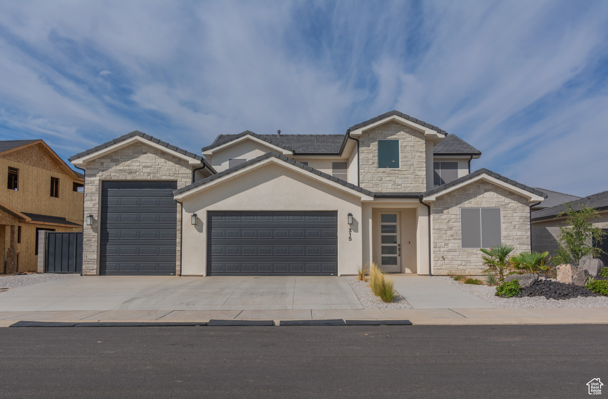 Stunning like-new home in Hurricane! This spacious home offers 5 bedrooms, 4 full bathrooms, plus a dedicated office-perfect for both living and working. Enjoy breathtaking views and plenty of parking with a 2-car garage and an impressive 46' deep RV garage. The RV garage is designed to easily fit all your toys! Covered patio and beautifully landscaped yard. Permanent lights. Nestled in the peaceful Firerock subdivision, just minutes from SR-9, this home combines convenience with quiet living. Don't miss your chance to make this like-new home yours!