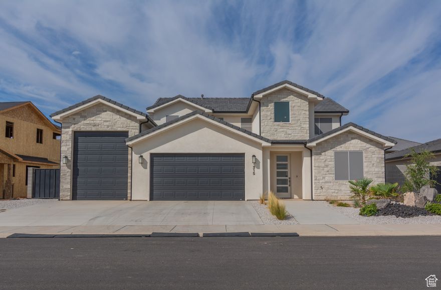 Stunning like-new home in Hurricane! This spacious home offers 5 bedrooms, 4 full bathrooms, plus a dedicated office-perfect for both living and working. Enjoy breathtaking views and plenty of parking with a 2-car garage and an impressive 46' deep RV garage. The RV garage is designed to easily fit all your toys! Covered patio and beautifully landscaped yard. Permanent lights. Nestled in the peaceful Firerock subdivision, just minutes from SR-9, this home combines convenience with quiet living. Don't miss your chance to make this like-new home yours!