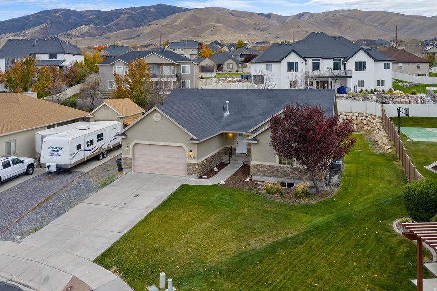 OPEN HOUSE: Saturday, January 10th from 11:00 AM 2:00 PM.  Breathtaking Location So Close to the Lake and Mountains!  Enjoy morning walks or bike rides along nearby trails, Talons Cove Golf Club and the Marinas, with sunrise and sunset views you'll never tire of so close by.  This updated Rambler features vaulted ceilings, brand-new LVP flooring, and fresh paint throughout for a clean, modern feel. Spacious open floor plan, 5 bedrooms, 4 baths, and a fully finished basement with large entertaining room plus theater area-perfect for family fun. Beautiful curb appeal with stone/stucco exterior on a large .24-acre lot. Motivated Seller-bring your offer! Quick move-in possible and easy to show!