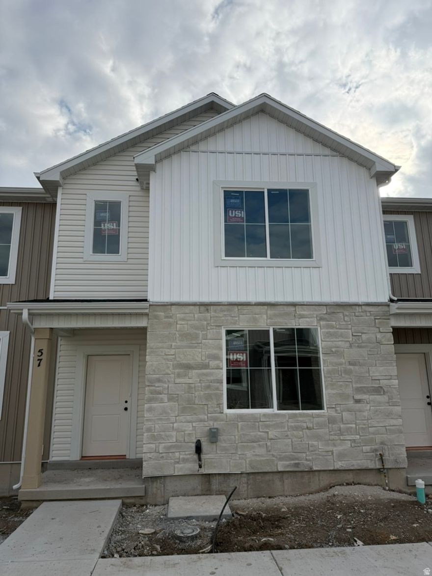 Seller offering a $10,000 incentive PLUS a fridge, washer, and dryer for a limited time! Also take advantage of the $20,000 first time home buyer grant from the state of Utah! Come check out this beautiful NEW townhome in an amazing community! This home has a 2 car garage, a large open kitchen and living space with high quality finishes including quartz countertops, LVP flooring, and stainless steel appliances. Upstairs you'll find 3 bedrooms, including a large primary suite with its own walk in closet. Enjoy all the amazing community amenities like the premium clubhouse, pool, spa, dog park, pavilion, basketball court, pickleball court, & playground. Enjoy beautiful views from this incredible location as well. HOA covers all exterior landscaping maintenance, exterior building maintenance, snow removal on driveways, property & liability insurance coverage, trash and internet up to 1 gig of high speed fiber optic. Two year builder warranty included. Square footage figures are provided as a courtesy estimate only and were obtained from sales brochure. Buyer is advised to obtain an independent measurement.