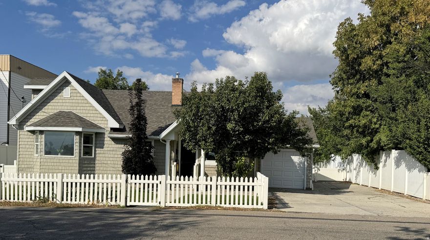 $5,000 Price Drop on this Charming East CoastInspired Bungalow in Millcreek. Don't miss this updated bungalow on a quiet street in the heart of Millcreek-perfect for a Personal Residence or a Investment Property or both. With an ADU attached. The home features inviting shingle siding, white vinyl fencing, and great curb appeal. Inside,  enjoy a bright living room with hardwood floors, two-tone paint, and updated lighting throughout. The refreshed kitchen includes new granite countertops, new appliances, and painted wood cabinetry, plus a spacious dining area with a bay window. The primary suite offers another bay window, a cozy fireplace, and an ensuite bath. Two additional bedrooms and a full bath complete the main level. The basement ADU includes its own entrance, kitchen, two bedrooms, and a full bath-ideal for rental income or extended living. The finished attic provides a versatile flex space. Outside, the fully fenced yard is perfect for kids, pets, and entertaining. There is also a covered entrance to the basement apartment. Square footage figures are provided as a courtesy estimate only and were obtained from county records. Home is vacant and easy to show, Lock Box is on front door. Schedule all Showings on Aligned Showings, corporate seller, Please allow 48 hours to respond to offers and all addenda. All measurements have been provided as a courtesy and have been obtained from county records as a courtesy and should be verified by the Buyer and Buyer's agent. The Seller has no seller's disclosures; Seller has not lived in the home.