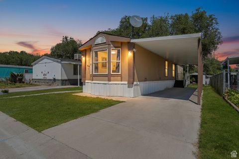 Photo of 7116 W BENDIXON DR #11, West Valley City, UT 84128 (MLS # 2105945)