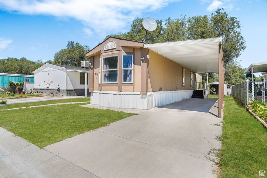 This charming mobile home offers generous sized bedrooms including a primary suite with its own private bathroom. Featuring an open layout, a kitchen with stainless steel appliances, new carpet, new paint & a covered carport providing convenient parking. Situated in a well-kept mobile park with easy access to shopping, dining & major roadways, this home is move-in ready & waiting for its new owner.