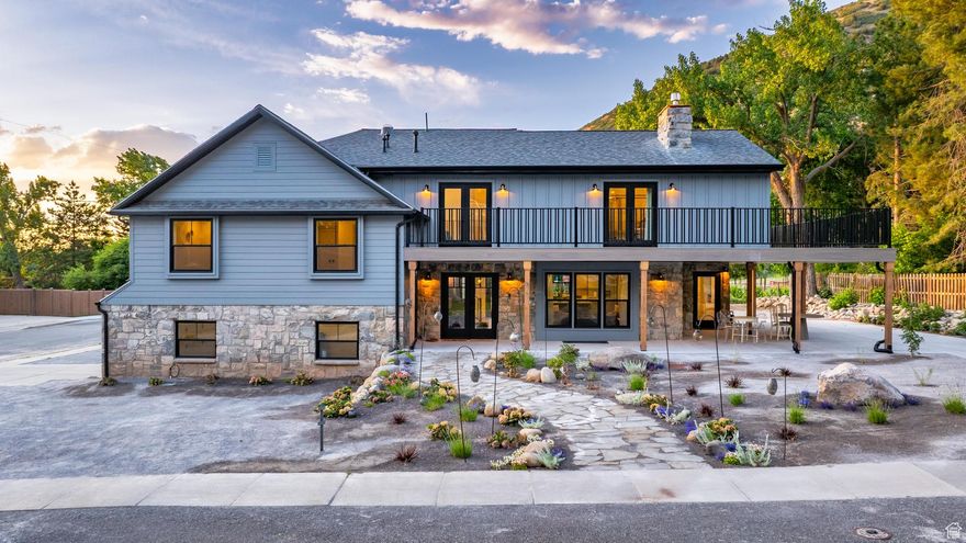 Priced Below Appraisal! Nestled behind the iconic La Caille vineyard and framed by the majestic peaks of Little Cottonwood Canyon, this boutique English-cottage-inspired home is a rare investment opportunity in Utah's fastest-growing luxury corridor. Completely rebuilt, NOT remodeled, from the ground up, the residence combines timeless cottage design with modern craftsmanship, creating an iconic property that will stand the test of time.  Perfectly positioned just minutes from six world-class ski resorts-including Snowbird and Alta-and surrounded by premier hiking and biking trails, the home offers unmatched year-round rental appeal. With flexible living spaces that include a private primary suite and a fully independent ADU with its own entrance and parking, investors will appreciate multiple income-producing options.  Expansive windows, wraparound decks, and a gourmet kitchen highlight the high-end rebuild, while the hot tub and spacious patio invite aprs-ski enjoyment. As Utah prepares for the 2034 Winter Olympics and continues to lead national growth rankings, this property is not only a stunning boutique residence but also a strategic investment in the state's thriving future.