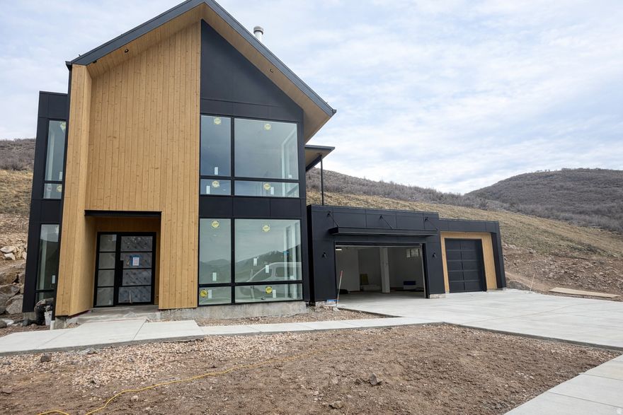 This luxury mountain modern home captures the essence of refined mountain living, offering breathtaking views of Deer Valley and the surrounding peaks. Perfectly situated within minutes of world-class skiing, it's the ideal retreat for those who want both convenience and exclusivity. Crafted with high-end finishes throughout, the spacious floor plan provides ample room for entertaining, while the three-car garage ensures plenty of space for vehicles and gear. With nightly rental approval, this residence also offers exceptional investment potential, combining lifestyle and opportunity in one remarkable property. Whether as a private getaway or an income-generating asset, it's the ultimate mountain retreat. Completion of home is spring of 2026.