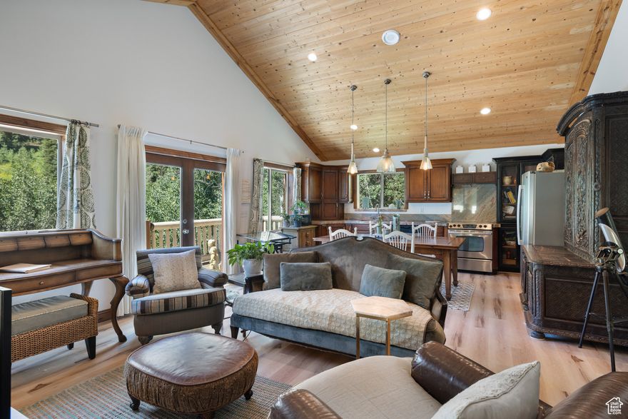 Surrounded by mature trees in Tollgate Canyon, this mountain cabin offers privacy, comfort, and year-round access just 25 minutes from Park City. Owned by a local artist, the 3-bedroom, 2-bath home showcases creative design alongside practical mountain living.  The main level features a bright open-concept living space with vaulted ceilings, large windows, a fireplace, and a well-appointed kitchen. The primary bedroom and bath with a soaking tub complete the main floor. The lower walkout level offers two guest bedrooms, a second living area, and a full bathroom, providing flexibility for guests, workspace, or a studio.  The home's artistic influence is felt throughout, with unique touches, warm materials, and a layout that invites creativity and comfort. Enjoy the wraparound deck with mountain and canyon views, frequent wildlife sightings, and direct access to miles of scenic mountain roads for exploring by foot, bike, or cross-country skis. The easy pull-through driveway adds convenience year-round. With close proximity to Park City resorts and reliable accessibility, this property is a quiet and creative retreat in the mountains of Summit County.