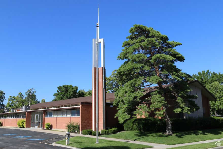 The property located at 855 E Garfield Avenue in Salt Lake City, Utah, is listed for $2,995,000. This property features a building with 15,788 square feet of space and sits on 1.14 acres of land. Offers will be reviewed after the property owner's mandatory 30-day listing period expires. It is zoned under the R-1-5000 code, which designates it for medium density residential for Single Family detached housing. Zoning and allowed uses must be confirmed with the city.