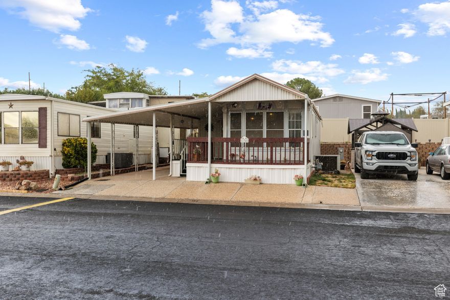 Discover the perfect blend of comfort and convenience in this charming home. Tucked into a welcoming 55+ community, it's just minutes from Costco, Walmart, scenic trails, and peaceful parks, giving you everything you need right at your door.  The home itself is in solid shape and needs new carpet (seller offering an allowance) and a touch of TLC, making it a great opportunity to add your personal style. With an extra bedroom for guests or hobbies and an 8x8 storage shed for all your essentials, you'll have plenty of space to stay organized.  Step outside to enjoy a spacious wraparound covered deck, ideal for morning coffee, evening visits with friends, or simply soaking in the fresh air year-round.  With a little finishing, you can create the cozy retreat you've been waiting for!