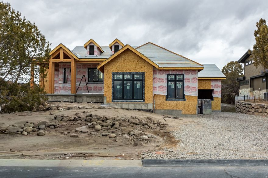 Currently Under construction. Full Golf Membership available(with club membership deposit) in the prestigious Red Ledges community, this custom 5-bedroom, 5-bathroom masterpiece is designed for luxury living. Backing directly onto the 18th hole of the Jack Nicklaus Signature Golf Course, this home offers breathtaking views and unparalleled access to world-class golfing. Nestled in a private cul-de-sac, the property has a full golf membership available with club membership deposit, ensuring immediate enjoyment of Red Ledges' exclusive amenities, blending sophistication with an active lifestyle. This stunning residence will feature a state-of-the-art theatre room with a golf simulator, perfect for entertainment and honing your swing year-round. The expansive 3-car garage provides ample space for vehicles and storage, while the open-concept design and high-end finishes elevate every detail. Ideal for those seeking a blend of modern luxury and outdoor adventure, this home promises to be a sanctuary of elegance and functionality in the heart of Red Ledges. Call with any questions about the plans of the home.