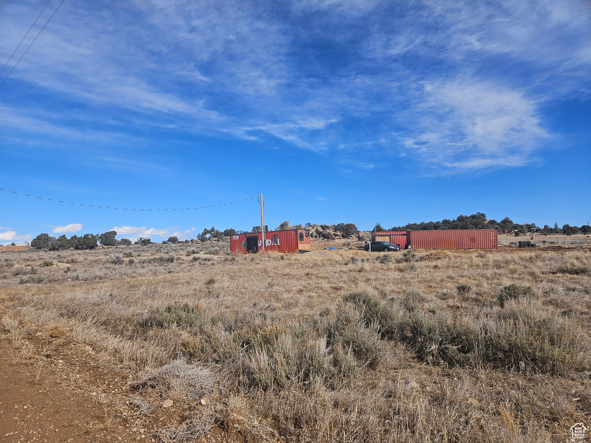 * READY TO BUILD 5 ACRE LAND WITH POWER, CITY WATER AND SEPTIC ALL CONNECTED!! * Amazing opportunity to own land at Red Creek Ranches in Fruitland! * No HOA or CCR's * All corners are surveyed & marked * Located just 2 mins of Hwy 40 with all year-round access & roads plowed to the property, just 5 mins from the Big G gas station * Sale includes a 40 ft storage container that was turned into a tiny home/office space with a wood burning fireplace/stove, bathroom, shower and small kitchen - unfinished all hooked up to the utilities * Great horse property nice & flat ground! * Secondary water lines run to the property with Red Creek Water * Beautiful views of the mountains & valleys below with stunning sunrises & sunsets!! * Come and camp, bring your RV's or build your dream home! * Only 20 mins from Strawberry Reservoir, Current Creek & Starvation plus many rivers & streams to fish! * Miles of 4-wheeling roads from the property up to Current Creek mountain and down to the Strawberry Pinnacles! Perfect location for all your outdoor adventures like boating, hunting, 4-wheeling, fishing & more! * 2 extra storage containers shown in photos will be excluded from the sale *