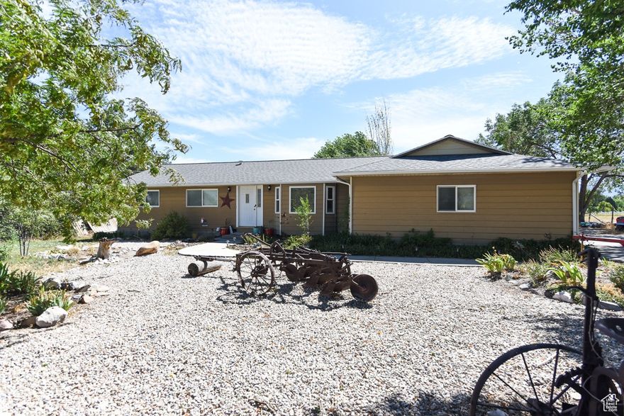 Incredible opportunity in a prime location with future commercial potential! This 1.47-acre horse property sits directly across from upcoming commercial development and next to an established medical plaza, offering excellent visibility and accessibility. Zoned for horses and equipped with a pole barn for shade, shelter, and storage. Recent updates include a new roof (Dec 2020), new garage door, new water heater, newer A/C and furnace, and garage door opener. Stunning mountain views and strong potential for future commercial conversion-don't miss the endless possibilities this parcel has to offer!  Please reference Commercial MLS # 2106737.