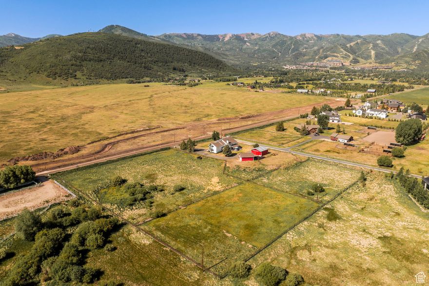 This stunning 4.4-acre property is situated to captivate the pastoral beauty and sweeping Canyons ski-run views amid Park City's coveted Old Ranch Road. Featuring 2 barns, riding arena and wide-open pastures, the property presents the unique opportunity to build your dream estate while living in the remodeled home. With no HOA, enjoy freedom of design, including customized outbuildings and recreational features. Two entrances, one on Old Meadow Lane, enhance the privacy and access. Just steps from the new Old Ranch Trail leading to miles of terrain for horseback riding, biking, hiking and xc-skiing to Round Valley and Willow Creek Park. Minutes from world-class skiing, Historic Main Street, Kimball Junction and Park City Schools.