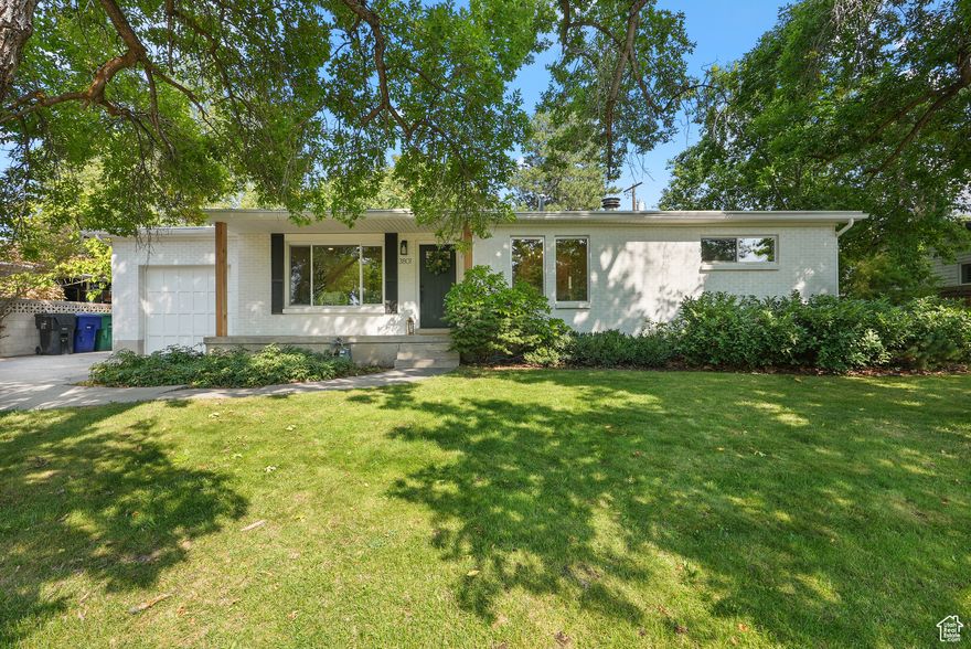 **Seller is open to Seller Financing with 20% down. **Welcome to this beautifully renovated 5-bedroom, 2-bathroom home designed with both style and function in mind. The open floor plan features a stunning kitchen with high-end, soft-close cabinets, creating the perfect space for entertaining and everyday living.  The lower level offers a full mother-in-law suite with its own kitchen, laundry hookups, and a cozy wood-burning fireplace - with the potential for a separate entrance, this space is perfect for extended family, guests, or rental opportunities.  With 2 laundry hookups, 2 kitchens, and thoughtfully updated finishes throughout, this home is as practical as it is beautiful. The bathrooms have been freshly updated with modern touches, and every detail has been carefully designed for  comfort.  Outside, you'll find mature trees (including 3 different fruit varieties) and a quaint backyard patio area, creating a private and relaxing outdoor retreat.  This move-in-ready home offers endless possibilities - whether you're looking for a multi-generational living space, rental income potential, or simply a gorgeous home to call your own.  Square footage figures are provided as a courtesy estimate only and were obtained from country records.  Buyer is advised to obtain an independent measurement.