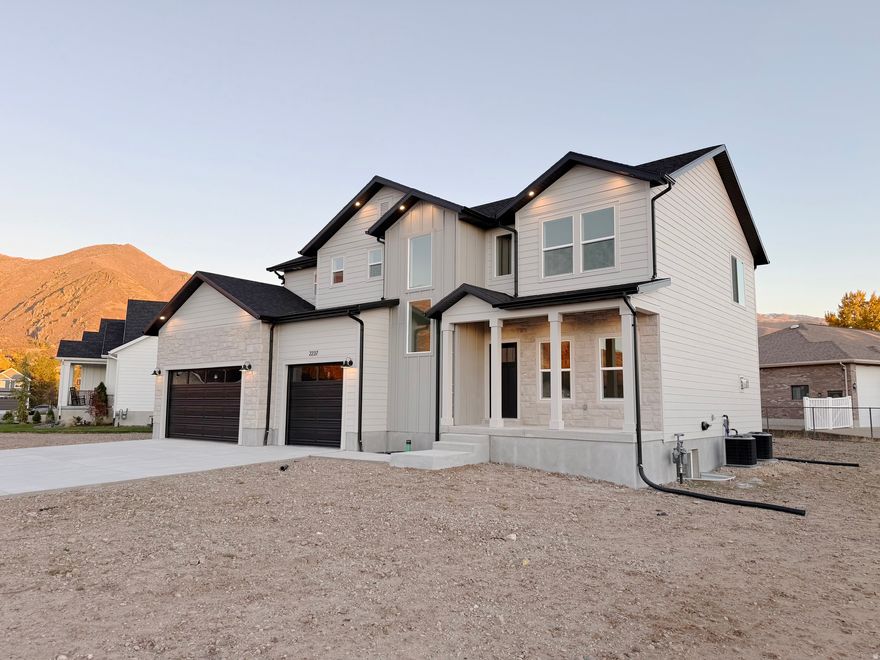 Nearly Complete! (Interior photos shown are from a previously built home with the same floor plan; finishes will vary.) This new two-story offers 4 bedrooms, 2.5 baths, and a private office on a quiet cul-de-sac with quick access to Highway 89 and Weber Canyon. Snowbasin is just 20 minutes away, Pineview Reservoir 30, and Salt Lake City International Airport 35. The main floor features 9-foot ceilings, an open layout, and a gas fireplace that flows into a chef's kitchen with expansive counters, custom tile backsplash, under-cabinet lighting, a large island, 5-burner gas cooktop with vented hood, double oven, and walk-in pantry. Upstairs, the primary suite includes a freestanding tub, custom tile shower, and oversized walk-in closet. Three bedrooms, a spacious laundry, and a full bath complete the level. Dual high-efficiency HVAC systems, modern lighting, and a generous backyard with mountain views add comfort and style. Square footage from plans; buyers should verify. Photos may not reflect exact finishes or features.