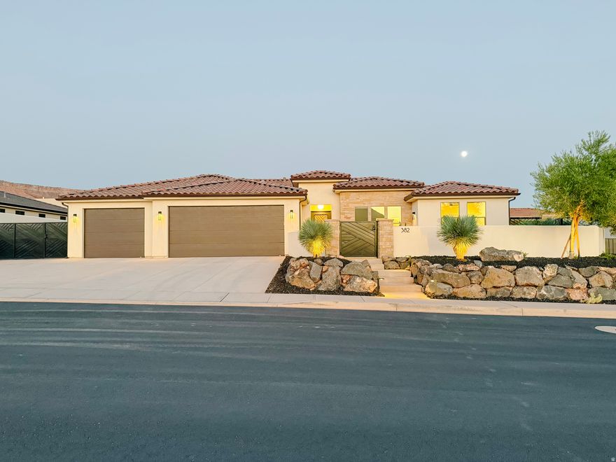 Quality built home with everything you are looking for! Located just 25 mins from downtown St. George and 30 mins to Zion National Park. Bring all of your toys as this home boasts a 4 car garage plus side yard RV Parking. Beautiful kitchen featuring an oversized island with cabinets beneath, gorgeous custom cabinetry, revers osmosis system, drink fridge, 2 sub zero fridge drawers & butler's pantry. Master suite w/ soaker tub & walk in shower, linen closet, dual vanities, sky light & walk in closet with custom cabinetry & shelving. Natural gas generator w/ auto transfer switch. Gated front courtyard. Fully fenced backyard with oversized back patio & pergola, perfect for entertaining.  Other upgrades include finished garage floor, soft water system, 240 volt plug in garage for EV charging, garage storage room w/ shelving, plumbing for garage sink & central vacuum system. Buyer to verify all information.