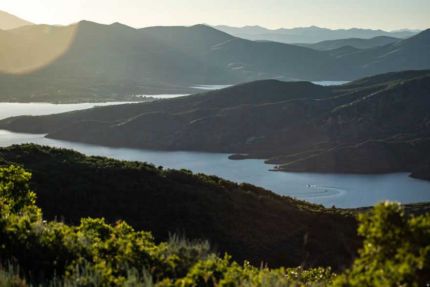 For starters, the land tells the story, and the views are something people simply haven't seen before until now. An exceptionally rare 44 acre developable ridgeline parcel overlooking Jordanelle Reservoir. The elevated setting reveals breathtaking, unobstructed panoramic views of Jordanelle Reservoir with Deer Valley's ski terrain and the new East Village as a dramatic backdrop. These extraordinary water and mountain views, combined with ultimate privacy, are the defining features of the property and represent a truly rare opportunity in the Wasatch Back. The parcel features mostly flat, highly buildable terrain and offers the potential to create approximately eight to nine 5 acre residential estate lots, depending on survey and county approval. Water, sewer, and other utilities are available to the site, providing strong infrastructure support for future development.  Unlike many surrounding luxury communities, there are no CC&Rs, no HOA, or restrictions, offering a rare opportunity to design and build without the limitations often found in resort developments. Here you have the freedom to create your own vision and truly be your own boss.  Located just off State Road 32 and neighboring premier luxury communities including Victory Ranch, Marcella Golf Club (Tiger Woods design), and Benloch Ranch, the property sits in one of the most desirable and rapidly growing luxury corridors surrounding Jordanelle Reservoir. Your neighbors truly do not get better than that.  The property is located within the Jordanelle Basin Overlay Zone (JBOZ) and the Jordanelle Special Service District (JSSD), which provide coordinated planning standards and infrastructure services for development throughout the Jordanelle Basin.  Just 15 minutes from Deer Valley's new East Village, this offering represents a rare opportunity to create luxury estate homesites capturing some of the most remarkable and previously unseen views of Jordanelle Reservoir and Deer Valley.