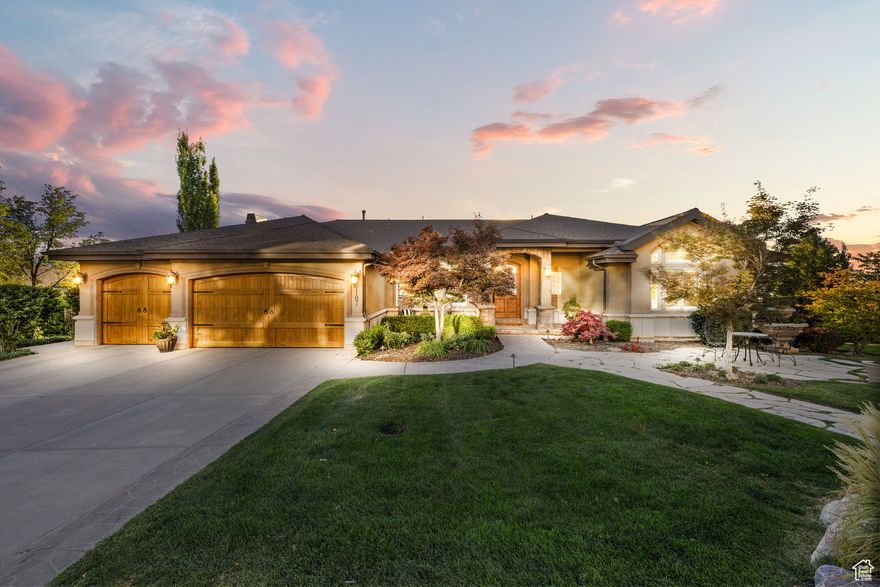 Perched above the city in Salt Lake's prestigious Dorchester Pointe, this extraordinary rambler is more than a home. From sunrise over the Wasatch to sunset beyond the Oquirrh Mountains, every window captures a view worth pausing for. Steps from Ensign Peak trails, the residence blends elegant design, thoughtful details, and an iconic setting into a lifestyle that feels both elevated and inviting. Inside, the chef's kitchen is designed for both beauty and performance, featuring Wolf and Sub-Zero appliances, dual dishwashers, and a built-in Miele coffee station, creating a space perfectly suited for everything from quiet mornings to grand entertaining. Expansive gathering spaces flow seamlessly to outdoor decks that invite morning coffee or evening city lights.  The light-filled primary suite offers sweeping valley panoramas and a spa-inspired bath, while the walkout lower level features a wet bar, spacious family room, and direct hot tub access for starlit evenings. Outside, lush landscaping, calming water features, and vibrant gardens create a peaceful retreat. With six bedrooms, five baths, a main-level office, and a three-car garage, along with easy access to downtown, the University of Utah, the airport, and endless hiking, this is a rare opportunity to live above it all while staying connected to everything. Thoughtfully priced to sell, this remarkable home offers unmatched value in one of Salt Lake's most sought-after neighborhoods.