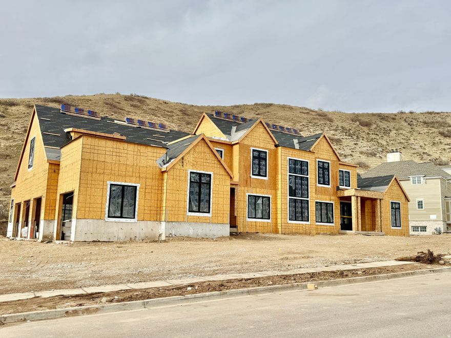 Nestled in a prestigious and sought-after community in Utah, this extraordinary estate in Alpine represents the pinnacle of luxury living. Known for its stunning mountain views, top-tier schools, and peaceful surroundings, Alpine offers a rare blend of exclusivity and natural beauty. Set on a fully usable and beautiful 1-acre lot, this home has been thoughtfully designed with every lifestyle in mind. Crafted with high-end finishes and workmanship, this home blends timeless architecture with modern functionality. Impressive windows designed to maximize natural light, creating a warm and inviting atmosphere throughout its expansive living spaces. The home is incredibly versatile and designed to accommodate every need, whether you're entertaining a crowd or enjoying a quiet evening. The following features are NOT included but can be negotiated at a cost-plus model: a private outdoor oasis with a custom pool, an outdoor pickleball court, an additional 5-car garage (ideal for housing recreational vehicles, collector cars, and all the family's toys), indoor sports court finishes (perfect for year-round friendly pickleball or basketball games), spa/sauna (roughin included), cold plunge (roughin included), gym, golf simulator (equipemnt not included, only the rough ins and connections), theater room (equipment not included, only the rough ins and connections), landscaping or other custom features.  Whether you're hosting friends, enjoying time with family, or seeking a peaceful retreat, this home has the potential for all of it!